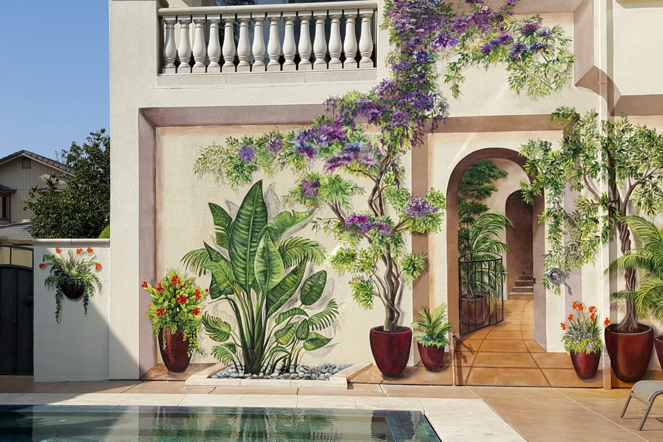 Trompe l’oeil mural painted at a clients home in Discovery Bay CA. The idea was to create the illusion that the wall has a hallway leading to stairs and a patio.