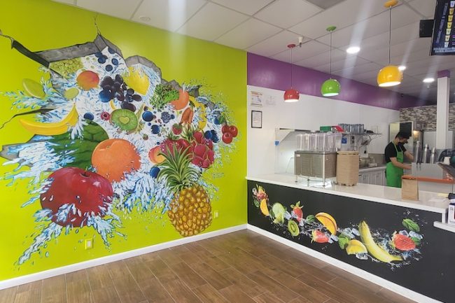 Trompe l’oeil mural for Fresh Fuel juicery in Hayward, CA. With strawberries, pineapples, blueberries, kiwi, and more.