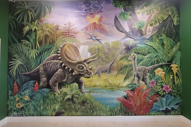 Mural of dinosaurs in a children's playroom